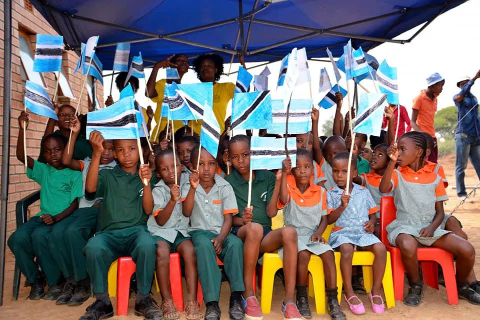 Children holding flags at a school